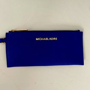 Michael Kors blue leather wristlet in excellent condition